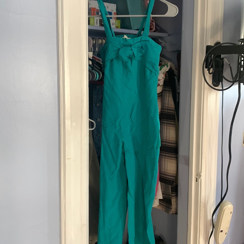 Teal jumper with bow on it